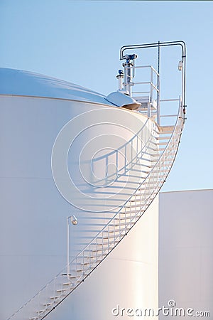 An industrial fuel storage tank and stairs. Editorial Stock Photo