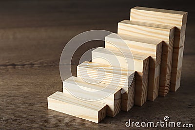 Steps made with blocks on table. Career ladder Stock Photo
