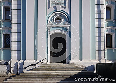 Steps and portal of the baroque bell tower in the territory of Trinity Monastery of St. Sergius. Sunny spring view. Editorial Stock Photo