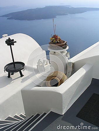 Steps, vase, and whitewashed walls. Santorini, Greece Stock Photo