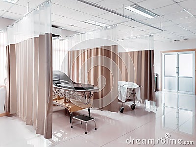 Sterile recovery room equipped with comfortable sickbed for patient recovery. Stock Photo