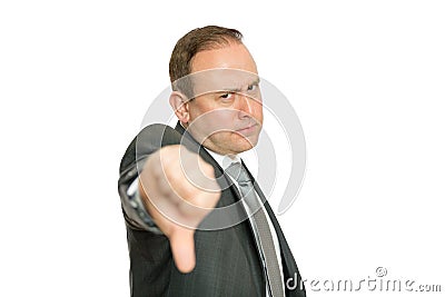 Stern, angry business man giving thumbs down Stock Photo