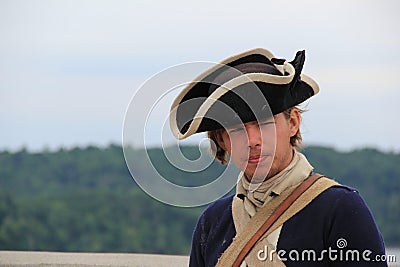 Stern expression on face of Young soldier during day's reenactment of soldier's life, Fort Ticonderoga,New York,2014 Editorial Stock Photo