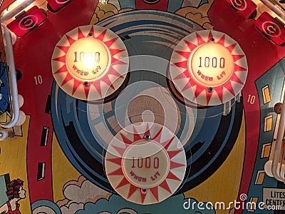 Stern Pinball machine playfield pop bumpers detail Stock Photo