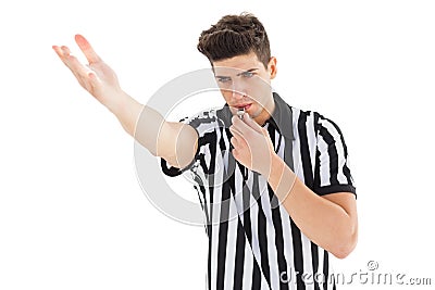 Stern referee blowing his whistle Stock Photo