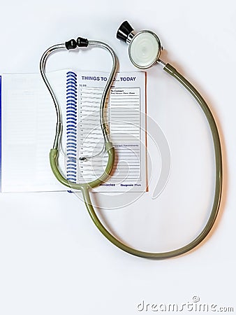 Stethoscop and planner on the doctor's table Stock Photo