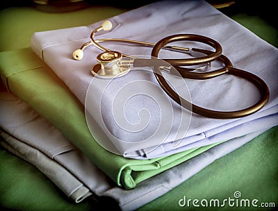 Stethoscope about blue and green nurse uniform in a hospital Stock Photo