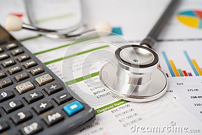 Stethoscope on calculator, Finance, Account, Statistics, Analytic research data and Business company medical health. Stock Photo