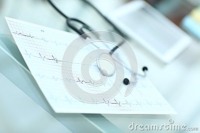 Stethoscope and cardiogram on a medical table Stock Photo