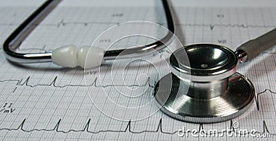stethoscope on cardiograph. Stock Photo