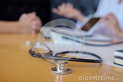 Stethoscope with clipboard and Laptop on desk Doctor working in Stock Photo