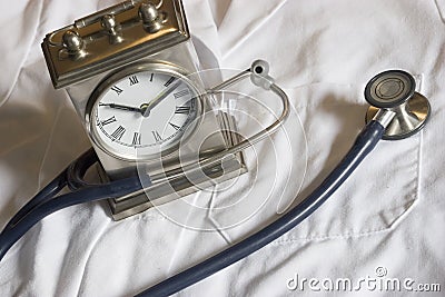 Stethoscope and Clock Stock Photo