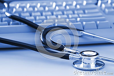 Stethoscope by Computer Keyboard Stock Photo