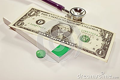 Stethoscope dollar , expenditure on health or financial assistance, Stock Photo