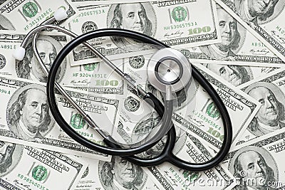 Stethoscope on the dollars. Medical costs. Healthcare payment concept. Concept of analysis of the market and economy and interest Stock Photo