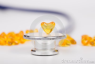 Stethoscope with drug heart shape Stock Photo