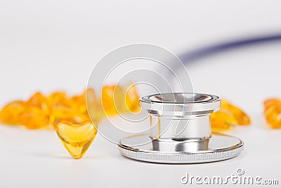 Stethoscope with drug heart shape Stock Photo