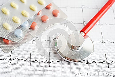 Stethoscope on electrocardiogram (ECG) with drug, heart wave, heart attack, cardiogram report Stock Photo