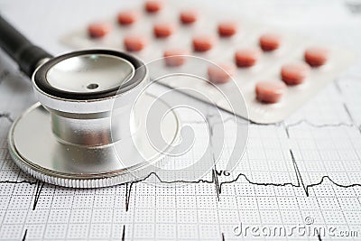 Stethoscope on electrocardiogram (ECG) with drug, heart wave, heart attack, cardiogram report Stock Photo