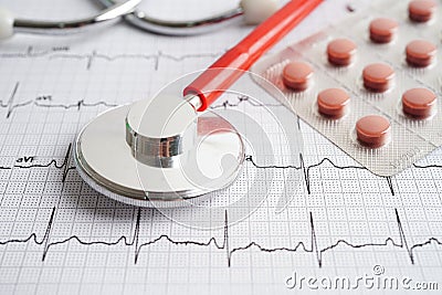 Stethoscope on electrocardiogram (ECG) with drug, heart wave, heart attack, cardiogram report Stock Photo