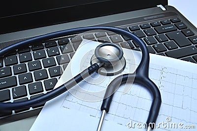 Stethoscope and electrocardiogram on a laptop Stock Photo