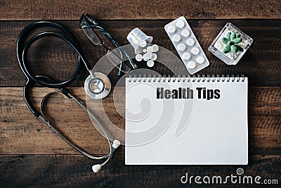 Stethoscope, eyeglass, medicine and notebook with HEALTH TIPS word Stock Photo