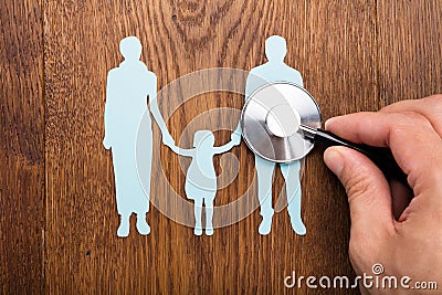 Stethoscope On Family Papercut Stock Photo