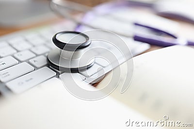 Stethoscope keyboard and diary on the table. Stock Photo