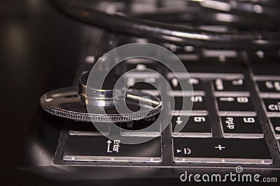 Stethoscope on keyboard Stock Photo