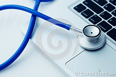 Stethoscope on laptop - Computer repair and maintenance concept. Stock Photo