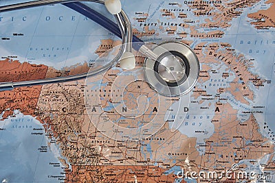 Stethoscope on the map of Canada, travel health insurance. Concept of national healthcare system - Canada Stock Photo