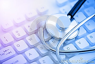 Stethoscope on computer keyboard Stock Photo