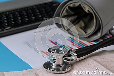 Stethoscope on the modern electric tonometer table with wireless computer keyboard Stock Photo