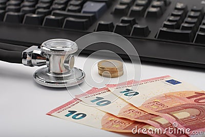 Stethoscope,money, keyboard on white, medical concept. Stock Photo