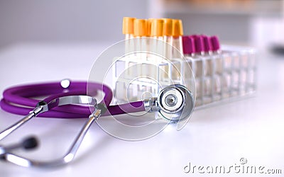 Stethoscope near medical tubes on white background Stock Photo