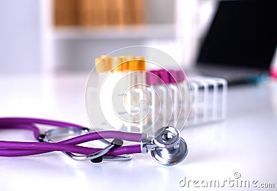 Stethoscope near medical tubes on white background Stock Photo