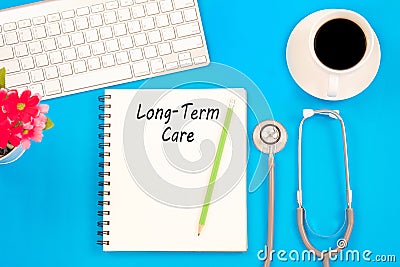 Stethoscope on notebook and pencil with Long Term Care words as Stock Photo