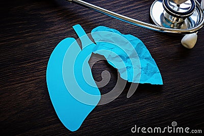 Stethoscope and one crumpled paper lung as a ground glass opacity after covid. Stock Photo