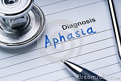 Stethoscope And Pen Over Form With Diagnosis Aphasia Stock Photo