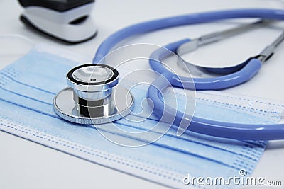 Stethoscope, Pulse Oximeter and medical face mask. Covid-19, healthcare concept Stock Photo