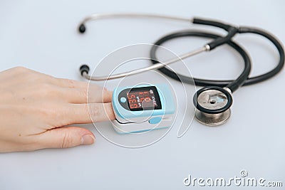 Stethoscope, pulse oximeter and thermometer gun on white background. Phonendoscope. Infrared isometric thermometer gun Stock Photo