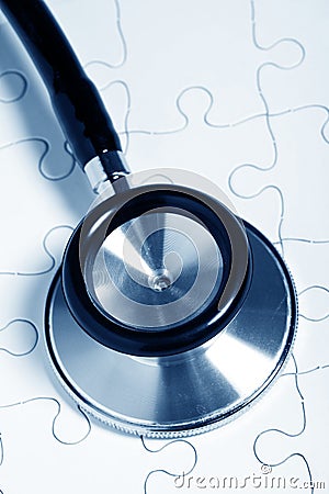 Stethoscope and puzzle Stock Photo