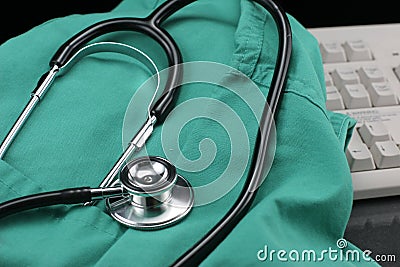 Stethoscope with smock & keyboard. Stock Photo