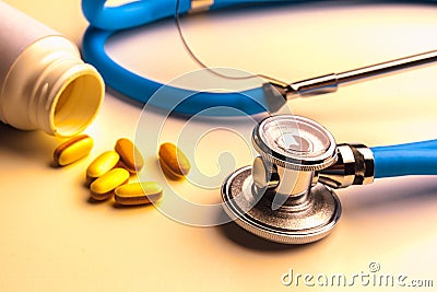 Stethoscope and some pills Stock Photo