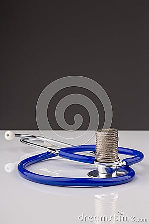 Stethoscope with a stack of coins Stock Photo