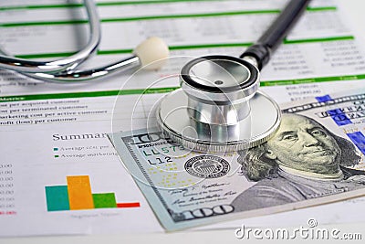 Stethoscope and US dollar banknote money. Finance, Account, Statistics, Investment, Analytic research data economy and Business Stock Photo