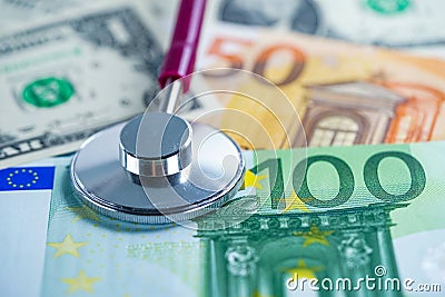 Stethoscope on US dollar and EURO banknotes, Finance, Account, Statistics, Analytic research data and Business company medical Stock Photo