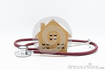 Stethoscope and wooden house. Image use for health medical care of family concept Stock Photo