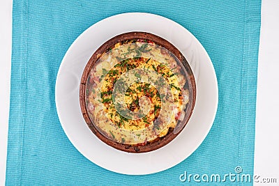 Stew of meat, vegetables and seafood, baked in a pot under a cheese crust Stock Photo