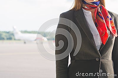 Stewardess on the airfield. Stock Photo